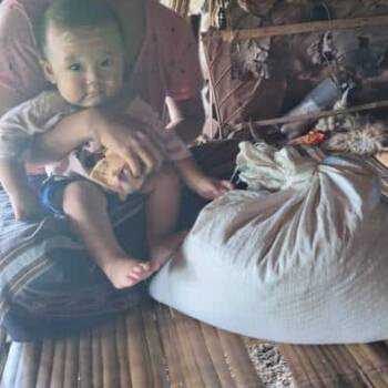 Mother and child receiving food supplies 2