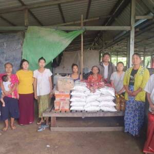 Karen villagers accepting food supplies