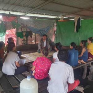 LFM staff listening to Karen villagers