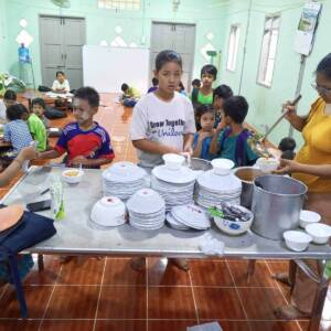 Leprosy community center tutoring session meal break