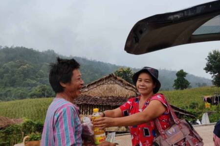 IDP camp villager receiving supplies