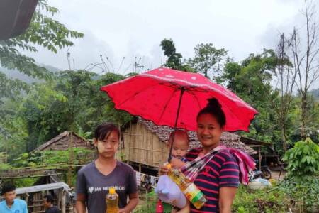 IDP camp villagers receiving supplies 2