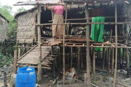 Repairing hut damage from Typhoon