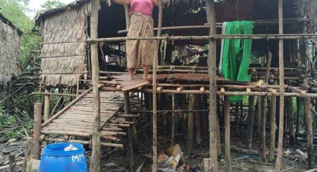 Repairing hut damage from Typhoon