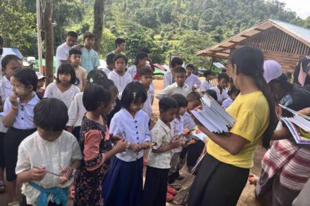 Providing school supplies to IDP camp children