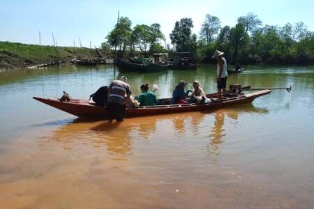 Newly purchased boat transporting villagers to church