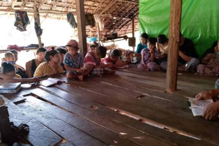 Village families gathered to hear the Gospel