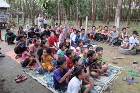 Villagers listening to Gospel message