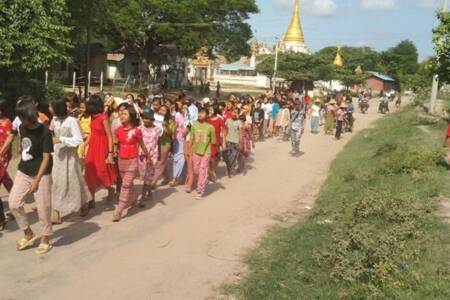 Villagers marching in protest