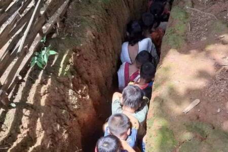 Children in protective trenches from bombing raid Children in protective trenches from bombing raid