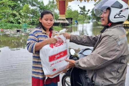 Delivering food supplies to flooded villager