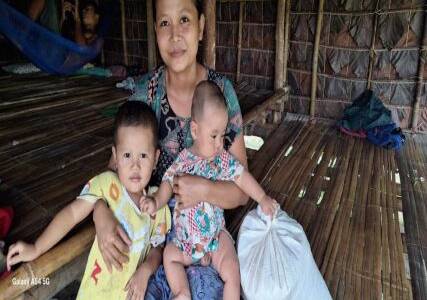 Mother and babies receiving supplies