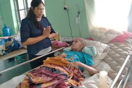 Our Chaplain with leprosy patient