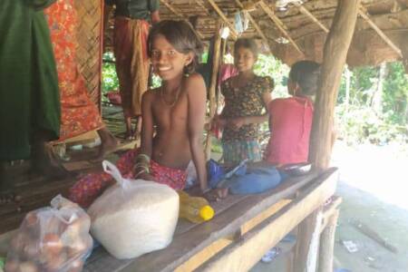 Smiling boy receiving food supplies